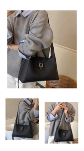 Détail d'un sac à main en cuir noir grainé avec une boucle carrée en métal élégante