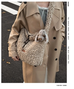 Detail of beige fleece tote bag featuring a cute 3D rabbit doll and wide plush shoulder strap