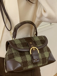 Vintage green tweed saddle bag with brown leather trim and golden buckle detail