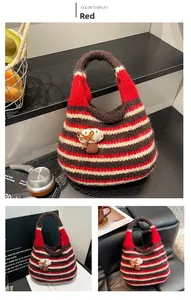 Close-up of handmade striped knit bag featuring a 3D felt mushroom decoration