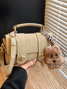 Vintage khaki Boston barrel bag for women with top dog charm and golden clasp
