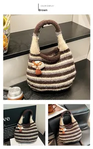 Detail showing the striped knit mushroom handbag with texture and decorative charm