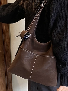 Vintage dark brown leather hobo bag with contrast stitching and eyewear loop