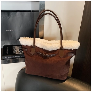 Detail of vintage brown suede tote bag with white faux fur trim and adjustable buckle