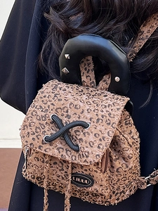 Mini leopard print backpack with faux fur texture and black leather accents for women