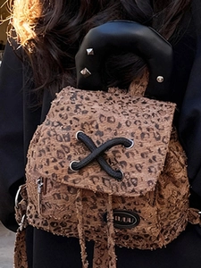 Chic leopard print mini backpack for women featuring plush fabric and rivet straps
