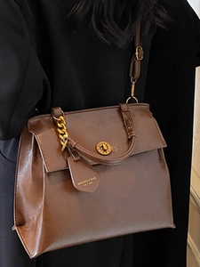 Vintage dark brown faux leather backpack for women with gold chain and rotary buckle details