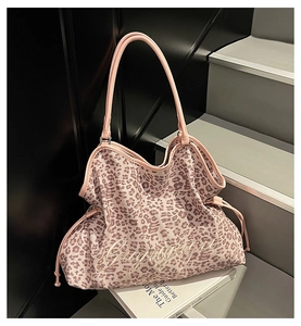 Detailed view of pink leopard print tote bag with embroidery and drawstring closure