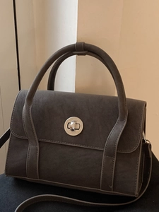 Vintage textured dark grey tote bag with silver twist lock and crossbody strap