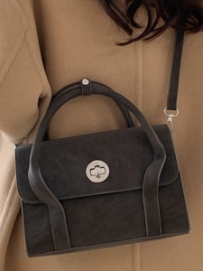 Vintage dark gray crossbody bag in matte suede leather with a round silver metallic lock