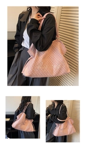 Detail of pink faux suede tote bag with white star pattern and brand embroidery