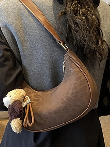 Retro dark brown crescent shoulder bag with leopard pattern and a cute bear charm
