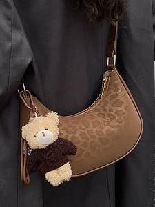 Vintage brown leopard print half-moon shoulder bag with a cute teddy bear charm