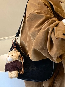 Retro black leopard print underarm bag with a cute brown bear doll pendant accessory