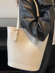 Modern white PU leather tote bag with adjustable shoulder strap and silver metal buckle