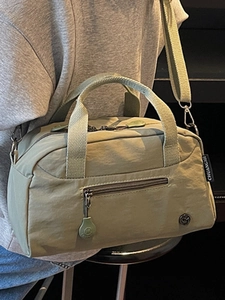 Minimalist green nylon crossbody tote bag with large capacity and water-resistant fabric