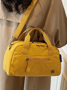 Minimalist bright yellow nylon tote bag for women with crossbody strap and urban style