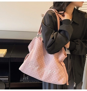 Pink suede tote bag featuring white star prints and Gugrigugri embroidery on shoulder