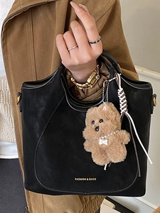 Retro large capacity black tote bag with cute brown teddy bear charm and logo detail