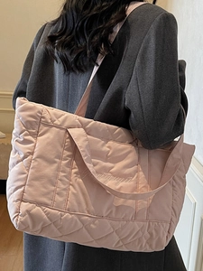 Pink quilted tote bag with diamond pattern and embroidery for winter fashion style
