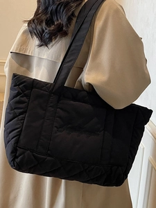 Quilted tote bag in black nylon with diamond stitching and elegant embroidery