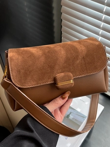 Caramel brown patchwork leather shoulder bag with gold buckle and wide strap for women