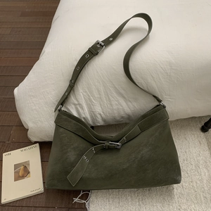 Detail of army green suede hobo bag with adjustable wide strap and metallic buckle