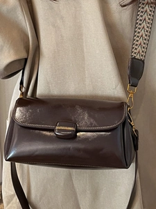 Dark brown faux leather crossbody bag with vintage woven strap and golden hardware