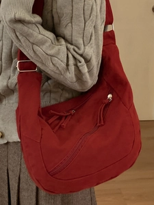 Red large capacity canvas crossbody bag in casual slouchy style for daily use