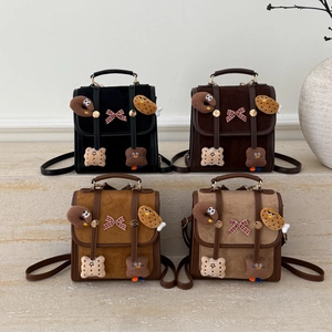 Minimalist mini backpacks in four colors featuring cute plush charms and bow details