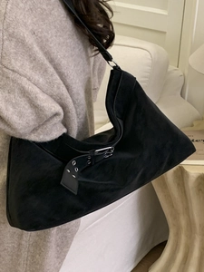 Large black suede hobo bag with adjustable silver eyelet strap for commute