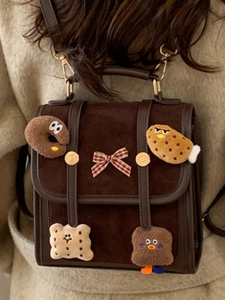 Retro dark brown school style backpack with cute cartoon patches and a red bow knot
