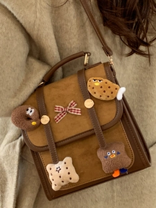 Brown retro soft suede backpack for women with cute plush charms and bow detail