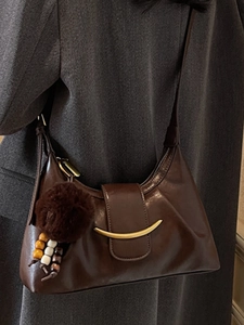 Large dark coffee crescent shoulder bag with gold hardware and plush charm for women