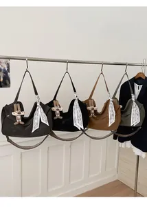 Detail view of large tote bags in four colors with bunny charms and floral scarves