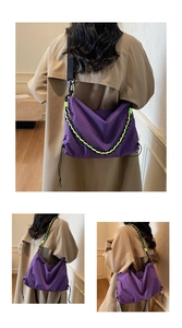 Detail of purple checkered crossbody bag with neon green chain and wide black strap