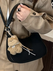 Fashion black half-moon shoulder bag for women with a cute brown plush toy bear charm