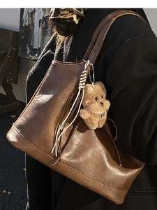 Minimalist large brown shoulder tote bag with a cute plush bear pendant accessory