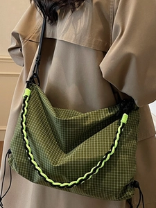 Large green checkered crossbody tote bag with adjustable shoulder strap and neon accents