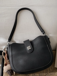 Retro black leather bucket bag with half-moon shape and plush ice cream charm decoration