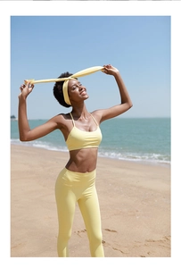 Three-piece lemon yellow yoga set including sports bra, high-waist leggings, and headband