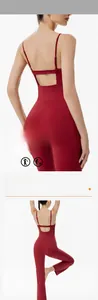 Detail of the open back cutout design and thin straps on this red fitness jumpsuit
