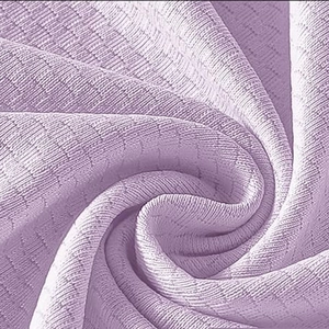 Close-up of light purple waffle knit fabric showing soft texture and breathable mesh pattern