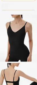 Close-up of black backless yoga jumpsuit showing slim fit fabric and V-neck detail