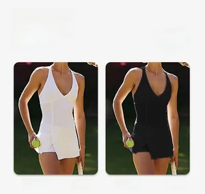 Detail view of V-neck tennis dress in black and white with side slit design