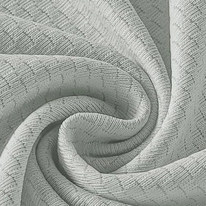 Detail of light grey breathable knit fabric with honeycomb texture and soft drape