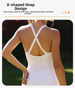 Detailed back view of white tennis dress with X-shaped cross straps and slim fit design