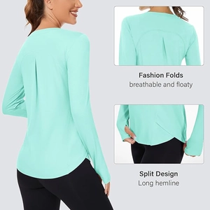Detail of mint green yoga top featuring pleated back design and curved split hemline