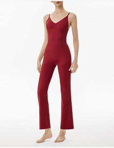 Detail showing the burgundy V-neck bodice and slim fit of the flare leg yoga bodysuit