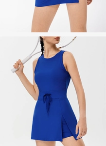 Detail view of the side slit and adjustable drawstring on navy backless tennis dress